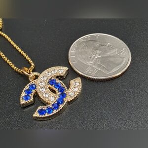 CHANEL Double C Pendant Necklace with blue and clear Stones. 18k PVD SS Chain.
